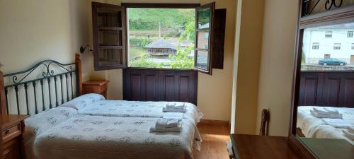 Postel nebo postele na pokoji v ubytování CASA MUNIELLOS