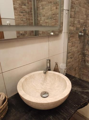 a bathroom with a sink and a mirror at Antico Podere Il Bugnolo in Poggibonsi
