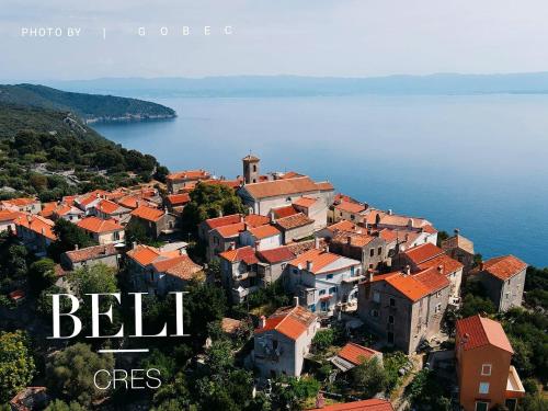 a town on the shore of a body of water at Pansion Tramontana in Beli