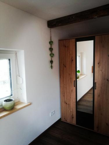 a room with a wooden door and a window at Ferienwohnung Jubiläumsgrat in Grainau