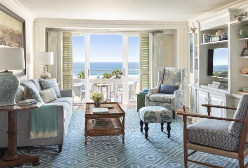 a living room with a view of the ocean at Shutters On The Beach in Los Angeles