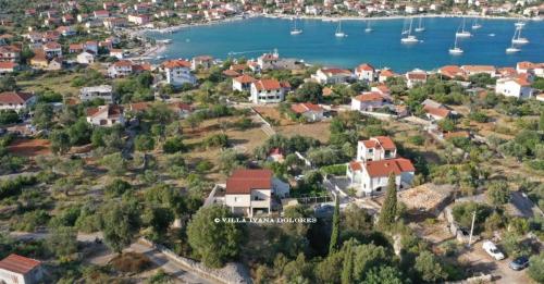 an aerial view of a house on a hill near the water at Vila Ivana Dolores in Vinišće