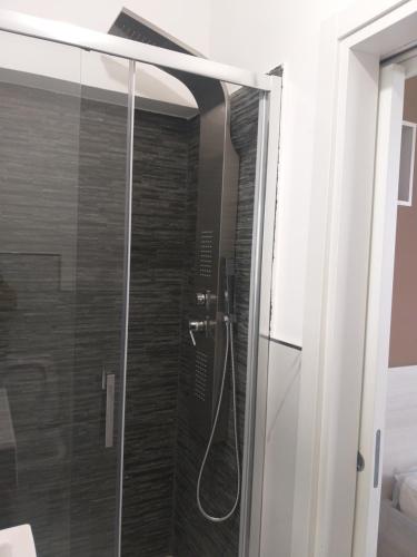 a shower with a glass door in a bathroom at Barlaam 3 in Reggio di Calabria