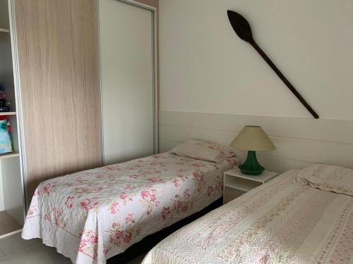 Cama ou camas em um quarto em Apartamento Duplex no Guarujá no Canto dos Tortugas