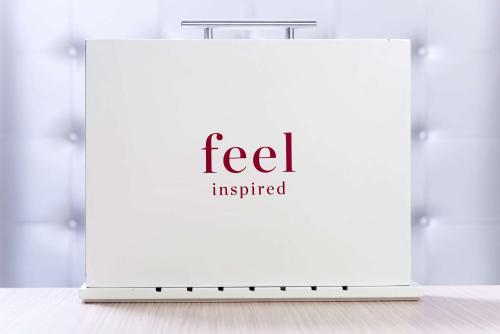 a white sign with the text fedex inspired at NH Collection Madrid Abascal in Madrid