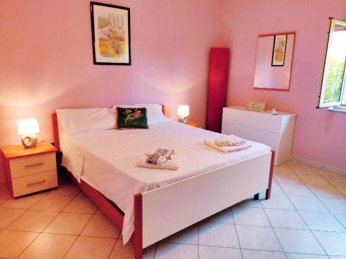 Säng eller sängar i ett rum på Villetta a Trebisacce con vista mare