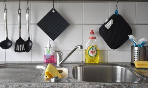 a kitchen counter with a sink and a sink at Tagus Life Apartment in Lisbon
