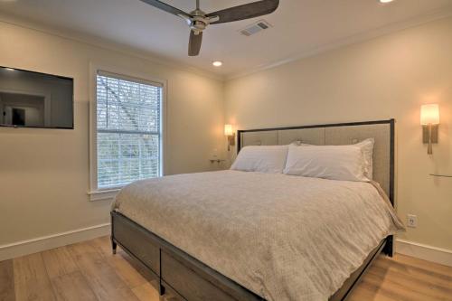 a bedroom with a large bed and a window at Newly Remodeled House Less Than 1 Mi to Dtwn Bentonville! in Bentonville