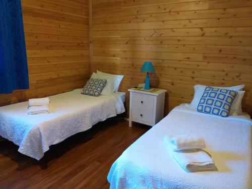 A bed or beds in a room at Quinta da Pavoa - Cottage House