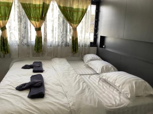 Postel nebo postele na pokoji v ubytování Room@Nimman