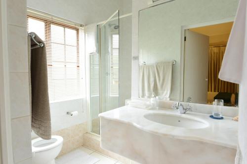 Ванна кімната в Highgrove Guesthouse