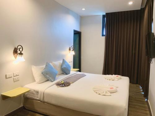 Ένα ή περισσότερα κρεβάτια σε δωμάτιο στο Behind The Scene Hotel Club @ Samui