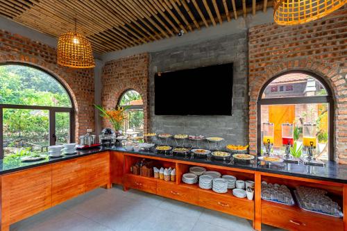 a kitchen with a counter with food on it at Tam Coc Banana Bungalow in Ninh Binh