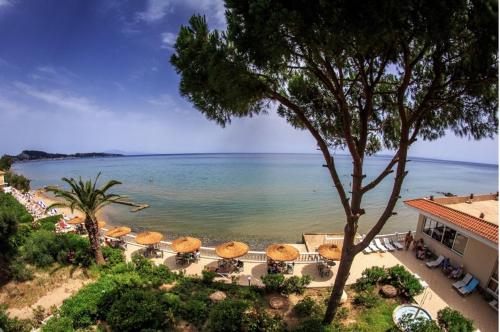 a view of the beach and the ocean from a resort at Chryssi Akti Hotel in Argasi