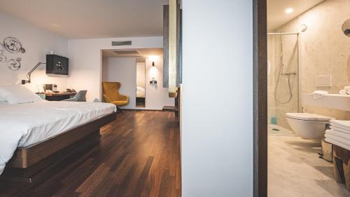 Postelja oz. postelje v sobi nastanitve Hotel Bernina Geneva