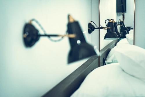 a row of head lights in a hospital room at Hotel Bernina Geneva in Geneva
