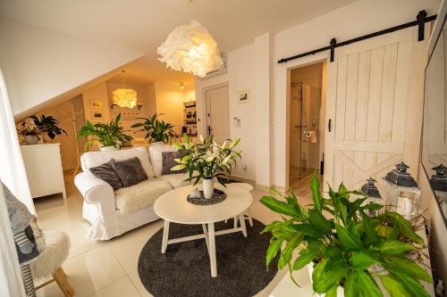 a living room with a couch and a table at Apartamenty Ceglana 1 A in Zielona Góra