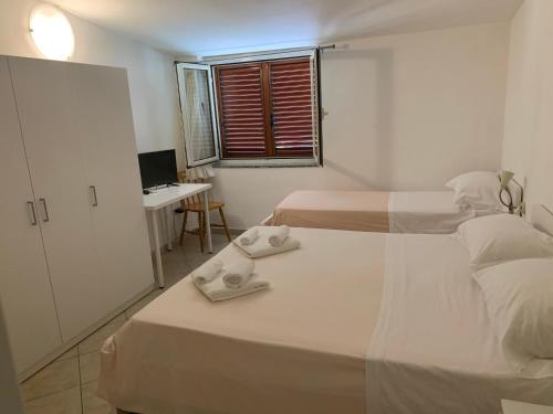 Postel nebo postele na pokoji v ubytování Hotel Due Pini Conte