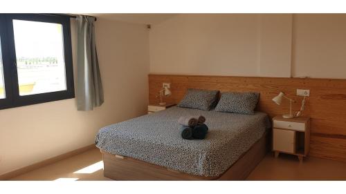 A bed or beds in a room at Joiebre