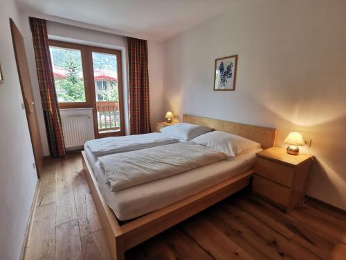 Ein Bett oder Betten in einem Zimmer der Unterkunft Schlossalm Appartement