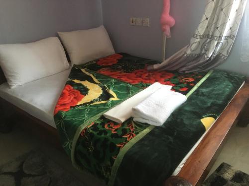 Een bed of bedden in een kamer bij Dodoma Siesta Inn