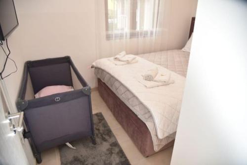 Katil atau katil-katil dalam bilik di Apartmani Sofrenic-Hotel Adonis