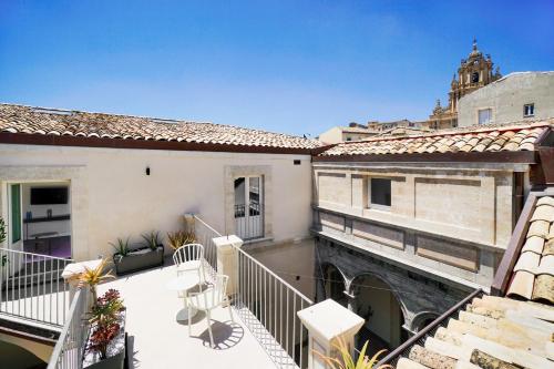 a building with a balcony and a balcony view at A.D. 1768 Boutique Hotel in Ragusa