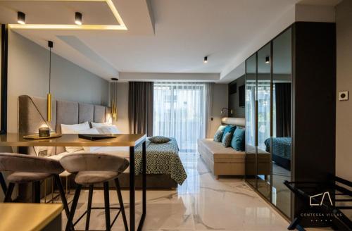 a hotel room with a desk and a bed at Luxury Apartments in Villa Curiera in Malinska