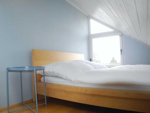 Кровать или кровати в номере Ferienwohnung Gretel