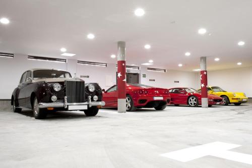 a group of cars parked in a garage at Costa Esmeralda Suites in Suances