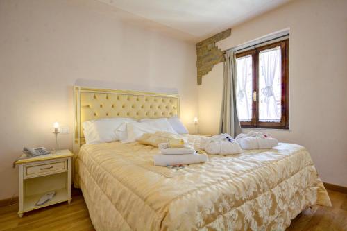 Postel nebo postele na pokoji v ubytování Hotel Volterra In