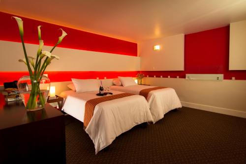 Cama ou camas em um quarto em Wakapunku Boutique Hotel