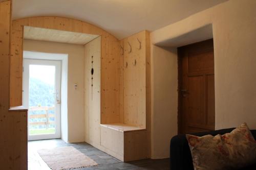 a room with a wall with a door and a window at Kieferhof in Iselsberg