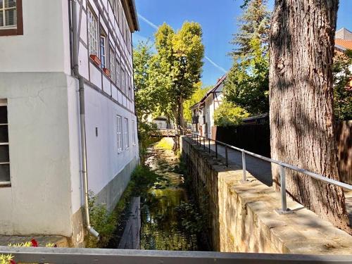 a canal between two buildings next to a building at Ferienhaus Zur Abzuchtinsel in Goslar