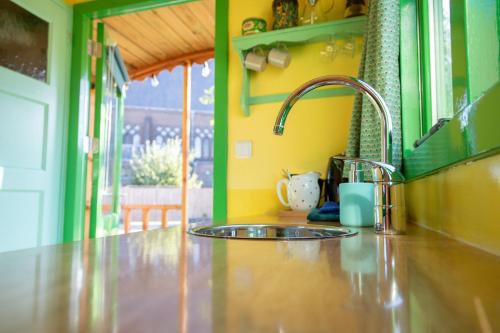 a kitchen with a sink and a counter top at Shanti B&B in Deventer