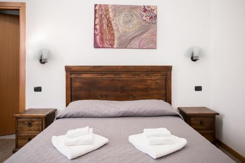 Postel nebo postele na pokoji v ubytování Hotel Amico