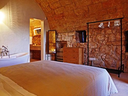 A bed or beds in a room at Agriturismo Le Fornelle