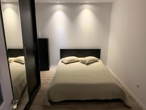 Ένα ή περισσότερα κρεβάτια σε δωμάτιο στο Apartment City Center