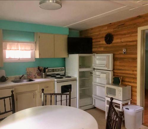 A kitchen or kitchenette at Forest & Lake PEI Cottages