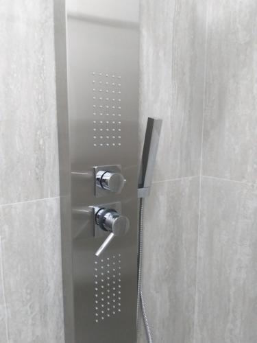 a shower with a glass door in a bathroom at Sant'Adriana in Reggio di Calabria