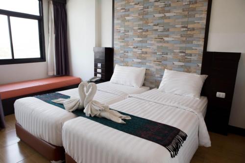 Una cama o camas en una habitación de Serene Residence