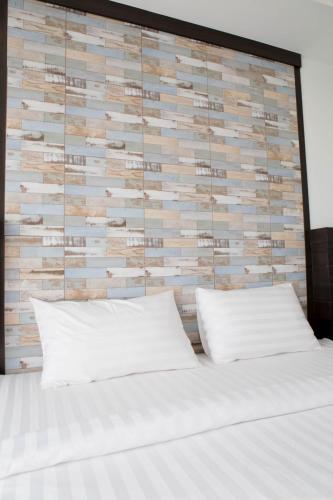 Una cama o camas en una habitación de Serene Residence