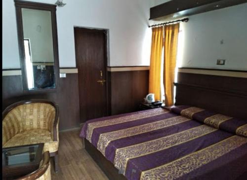 Ένα ή περισσότερα κρεβάτια σε δωμάτιο στο GMVN Auli