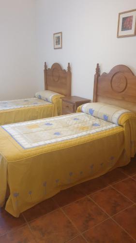A bed or beds in a room at El Molino de la laguna