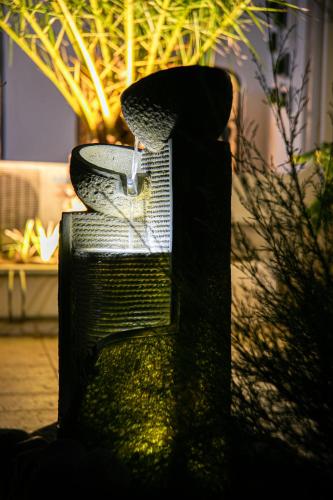 a water fountain in the middle of a building at Le Mas de Cocagne in Saintes-Maries-de-la-Mer