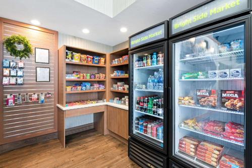 a store refrigerator with its doors open with food at La Quinta by Wyndham Logan in Logan