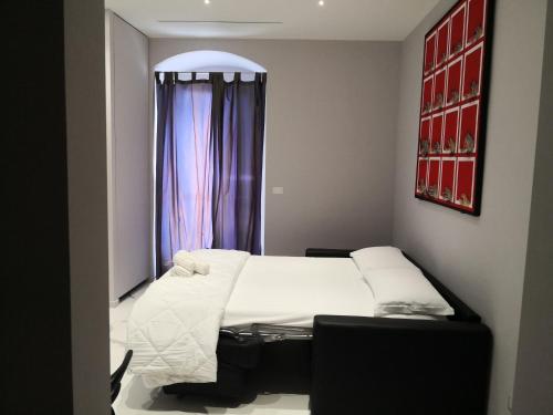 a small room with a bed and a window at Dimore Pietrapenta Apartments, Suites & Rooms - Via Lucana 223, Via Piave 23, Via Chiancalata 16, Vico Fornaci 9 in Matera