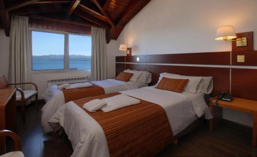 Postel nebo postele na pokoji v ubytování Hotel Tirol