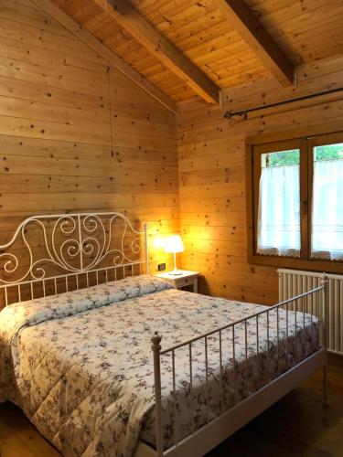 Postel nebo postele na pokoji v ubytování CHALET B&B LAGHETTI MARTINA