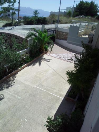 a parking lot with a ramp and a building at Mariana Apartments in Sarandë